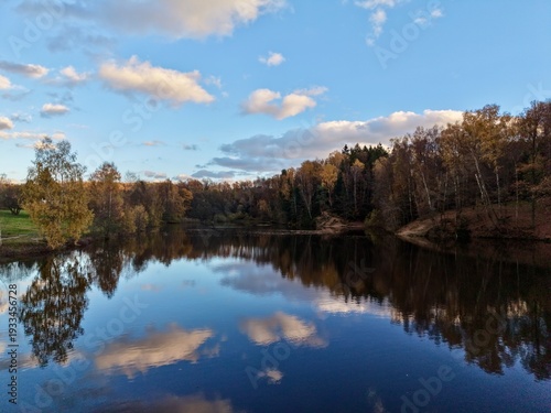 water mirrors sky, capturing broad perspective of bright sky reflected on tranquil lake surface