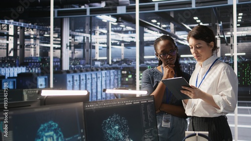 Photos Teamworking engineers in data center integrate AI automation tools together during maintenance session