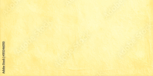 Pale yellow vintage paper texture background with subtle mottled parchment effect for antique or luxury design projects