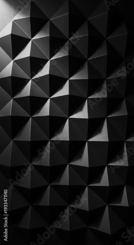 Dark three dimensional geometric surface displays repeating pattern of triangular facets