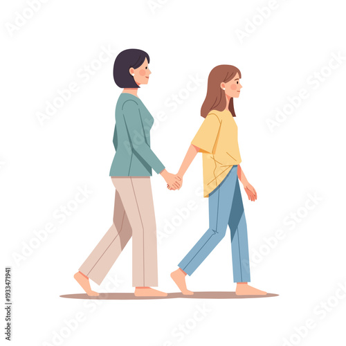 Two Women Holding Hands While Walking.