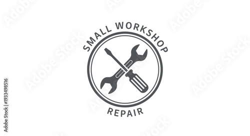 Wrench and Screwdriver Crossed in Circle.