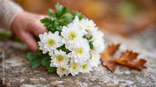 Elegant bouquet of white chrysanthemums on rustic stone surface