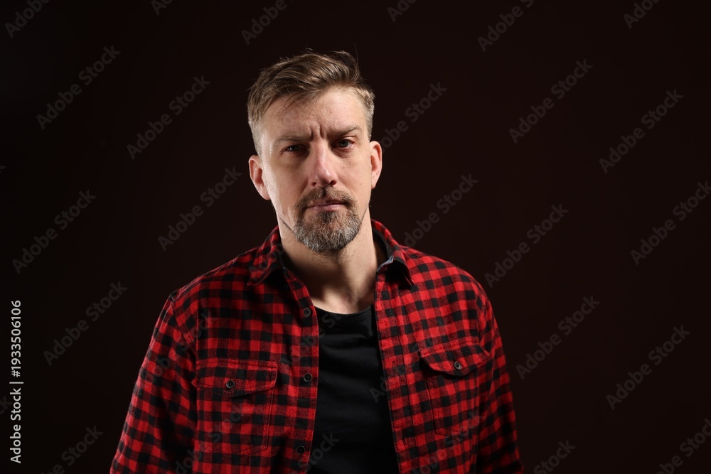 Fototapeta premium Brutal man with beard on dark background