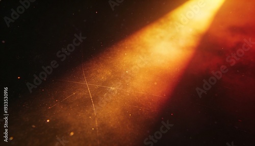 A bright beam of light shines through a dark, starry space with warm, orange hues and a sense of depth