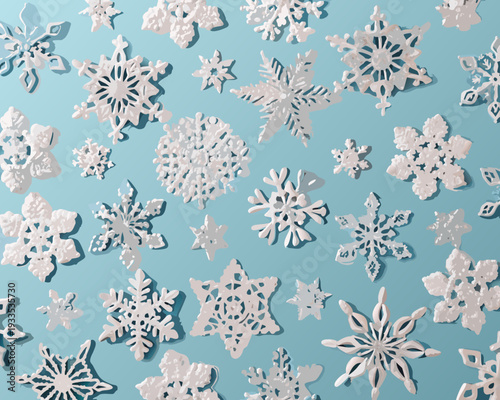 Delicate paper snowflakes scattered across a light blue background
