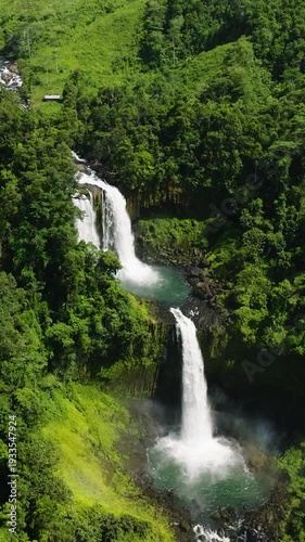 Wallpaper Mural Natural beauty of nature in tropical mountain. Limunsudan Falls in the Philippines. Mindanao. Vertical view. Torontodigital.ca