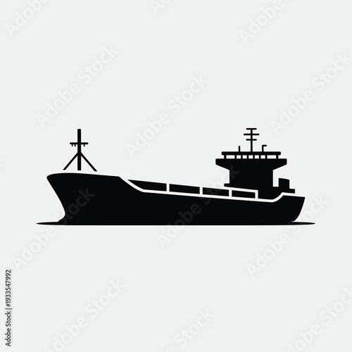 Silhouette of a large cargo ship against a pale gray background
