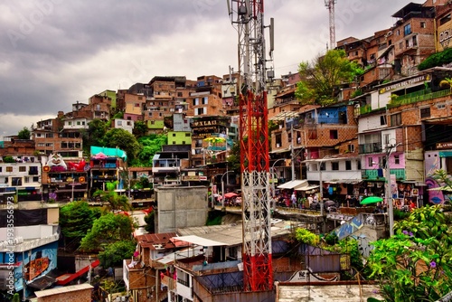 Vibrant street art in Comuna 13, Medellin. Iconic electric escalators, colorful graffiti, and urban transformation. Ideal for travel, culture, and South American tourism photography.