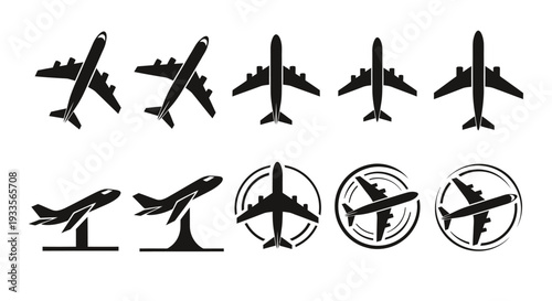 Collection of black airplane silhouettes in various positions and angles.