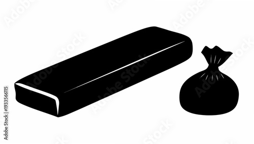 Black trash bag and tied garbage sack beside rectangular object