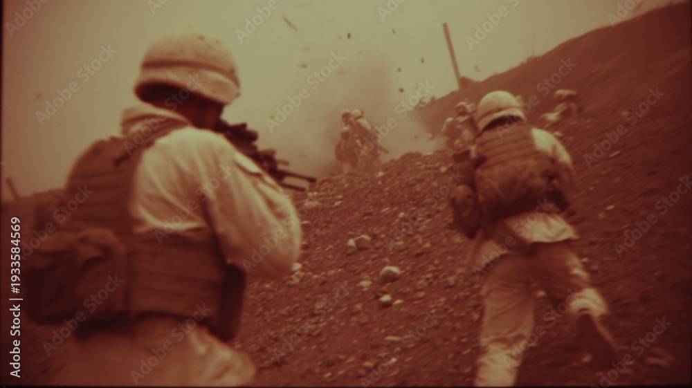 Fototapeta premium Troops Advancing Under Fire on Rocky Terrain in a Simulated Combat Training Exercise