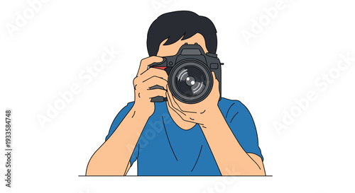 A male photographer wearing a simple blue t-shirt is holding a black DSLR camera to his face, preparing to take a focused picture.
