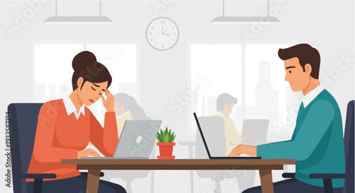 Office workers experiencing stress and burnout while working on their laptops in a modern office environment