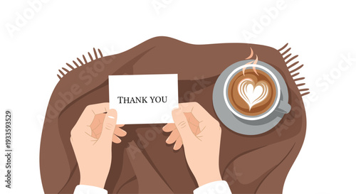From a top-down perspective, two hands hold a white THANK YOU card next to a steaming cup of coffee with heart-shaped latte art.