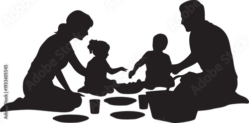 Black silhouette of family with two small children sitting on floor making food
