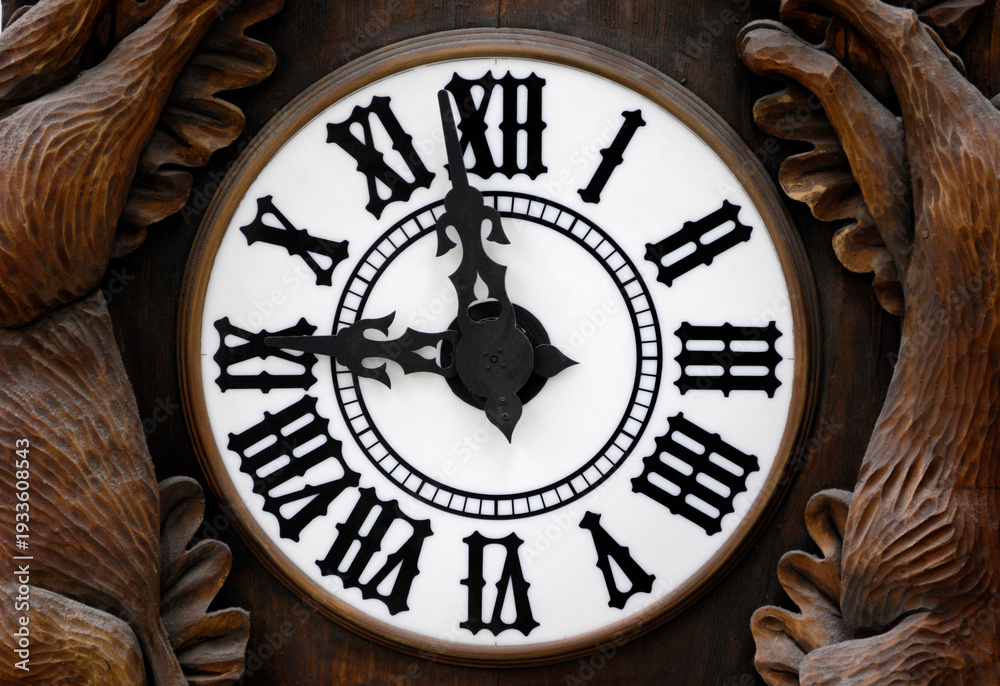 Fototapeta premium Old Wooden Clock Dial with hands at nine o'clock