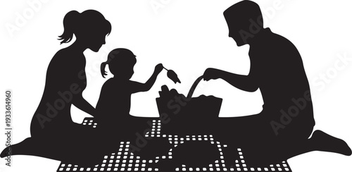 Black silhouette of family having picnic on blanket