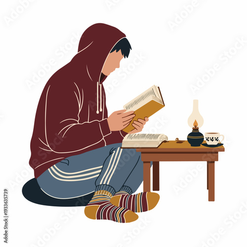 Cozy reading: Person in hoodie and socks absorbed in a book, with an oil lamp and coffee on a small table, embodying quiet study and home relaxation.