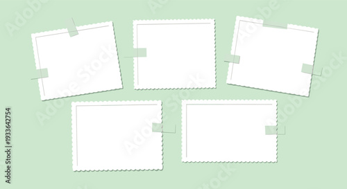 Five blank scalloped-edge photo frames of various sizes attached with green adhesive tape to a light green background for a scrapbook.
