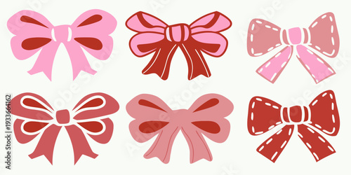 A collection of six decorative pink and red bows in various styles