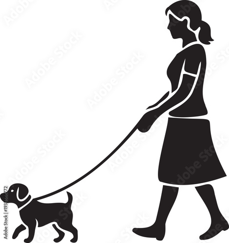 Woman walking dog on leash in park