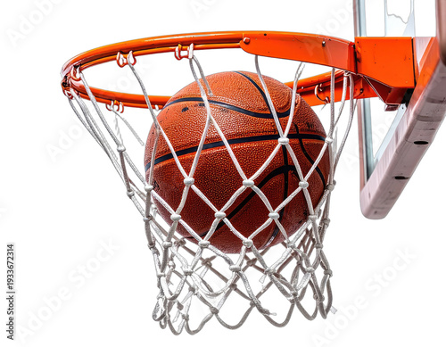 Ball descends into a net with an orange rim against dark background