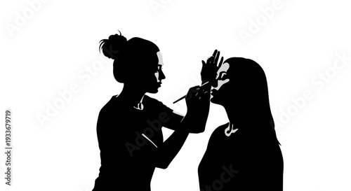Makeup Artist Applying Cosmetics to Woman Silhouette