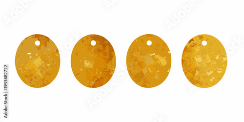 Four golden oval pendants with textured speckled surfaces arranged in a row