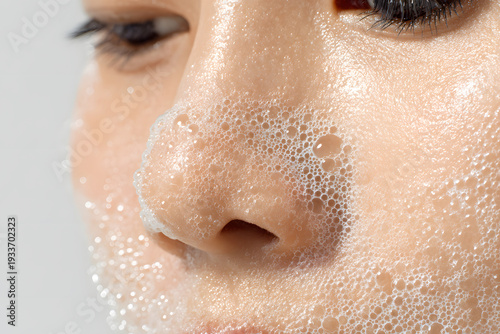 Close-up of a woman’s nose with water splash representing skincare and beauty treatment concept