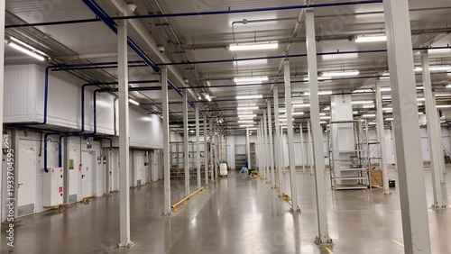 Photos Empty industrial warehouse interior with cooling systems and bright LED lighting