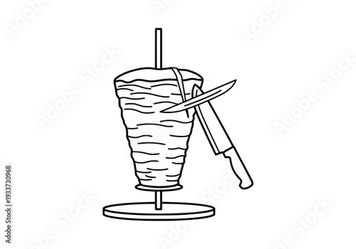 A knife rests on a tall glass of iced beverage with a straw on a round table viewed from the side.