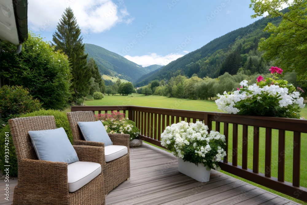 Fototapeta premium Terrace with chairs overlooking green mountain valley