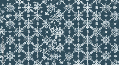 Seamless winter pattern of various white snowflake designs on a dark teal background for seasonal wrapping paper.