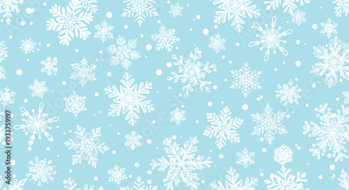 Artistic pattern of hand drawn white snowflakes on a light blue background for winter and Christmas theme design.