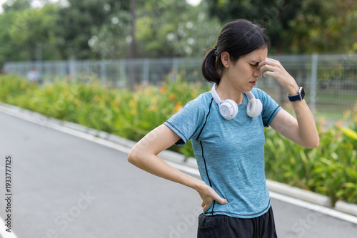 Tableau sur toile Fitness women feeling dizzy and exhausted after outdoor running workout in park