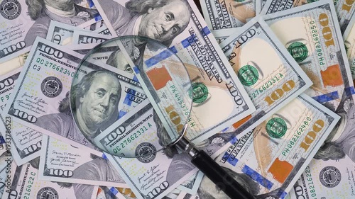 Wallpaper Mural The hands of an elderly accountant sort through US $100 bills and examine them with a magnifying glass. Torontodigital.ca