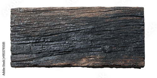 A weathered piece of dark wood, textured with visible grains and a black, charred appearance