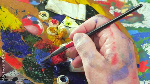 Wallpaper Mural The hands of the artist, work to create creative images in art. Art paints and brushes, applying multi-coloured strokes to the canvas using palette, gouache and watercolour. Torontodigital.ca