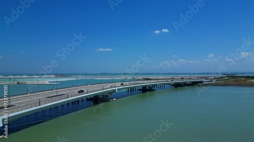 Wallpaper Mural Gurney Drive seaside, showing traffic on bridge, Artificial island and ongoing land reclamation. Unbelievable aerial view
ascending raise up drone Torontodigital.ca
