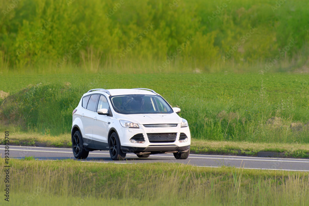 Fototapeta premium Driving a 4x4 SUV through green nature