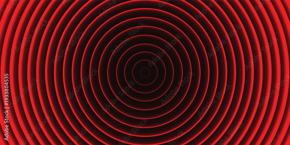 Obraz premium A vibrant red circular pattern with concentric rings on a dark background