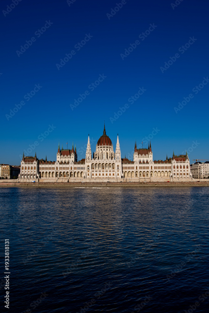 Obraz premium Travel destination in Hungary. Panorama of Budapest with Danube and Parliament. Gothic architectural in Budapest. Historic landmark and national symbol of Hungary on Danube.