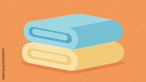 Stack of two neatly folded spa towels in soft blue and yellow colors resting on a warm orange background for bathroom decor.