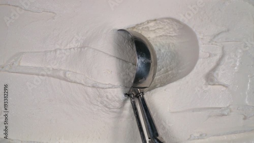 Wallpaper Mural Vanilla ice cream in a metal container, scooped out with a packing spoon. Torontodigital.ca