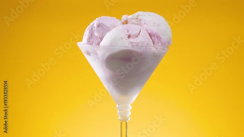 Wallpaper Mural Vanilla ice cream in a glass vase slowly rotates around its axis, against a bright background. Torontodigital.ca