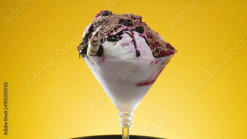 Wallpaper Mural Fruit ice cream in a glass goblet covered with chocolate fudge slowly rotates around its axis Torontodigital.ca