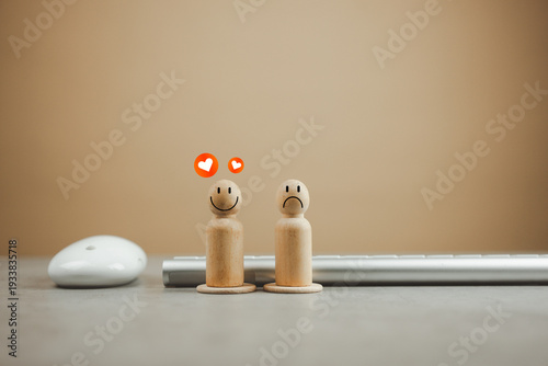 Wallpaper Mural Two wooden peg dolls one happy and red hearts floating above, and one sad, placed in front of the keyboard and mouse, representing different customer satisfaction levels Torontodigital.ca