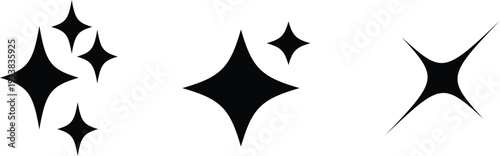 A collection of five black glimmering shapes resembling stars on a bright white surface