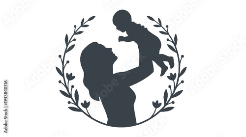 Mother holding baby up surrounded by a decorative leaf wreath